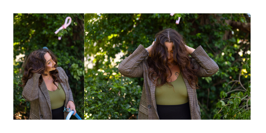 Woman revealing full, bouncy curls after removing satin heatless curlers, showcasing the results of overnight no-heat hair styling.